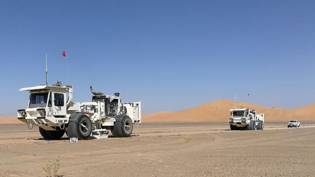 Seismic vibrator trucks in the desert