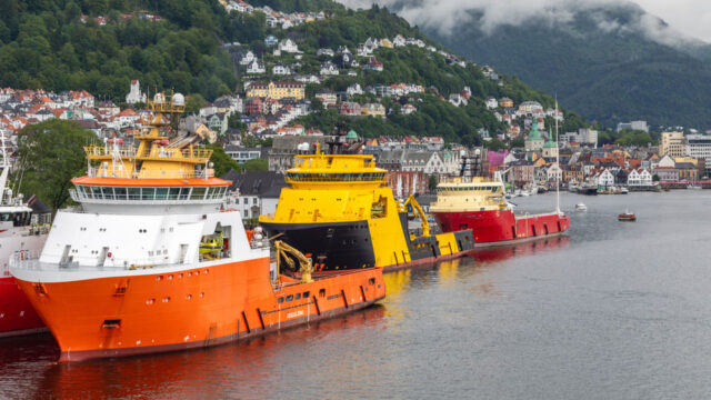Colorful Oil Rig Platform Supply Vessel Ships Lined up in the Bergen, Norway harbor