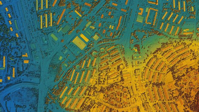 Aerial, geospatial data view of a semi-urban area with buildings, roads, and junctions