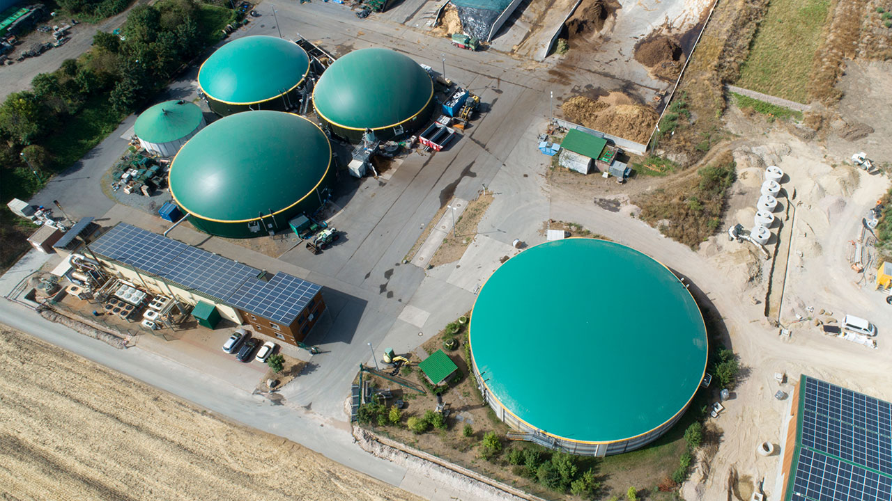 Aerial view of multiple anaerobic digesters representing biogas services