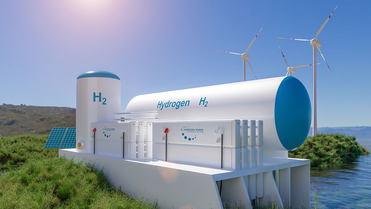 Hydrogen tanks pictured in front of wind turbines