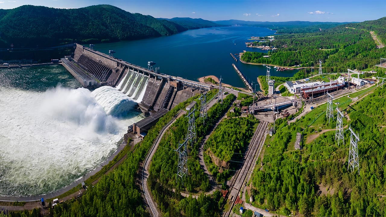 Water rushes over a spillway at a hydropower facility