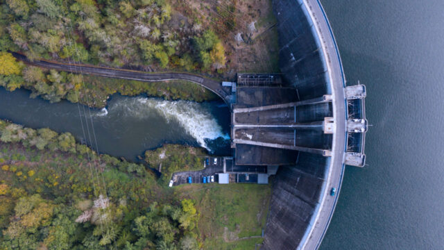 Overhead view of a hydropower dam and facility