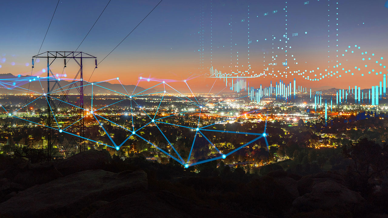 Data elements overlay a picture of a transmission line in an urban area at sunset