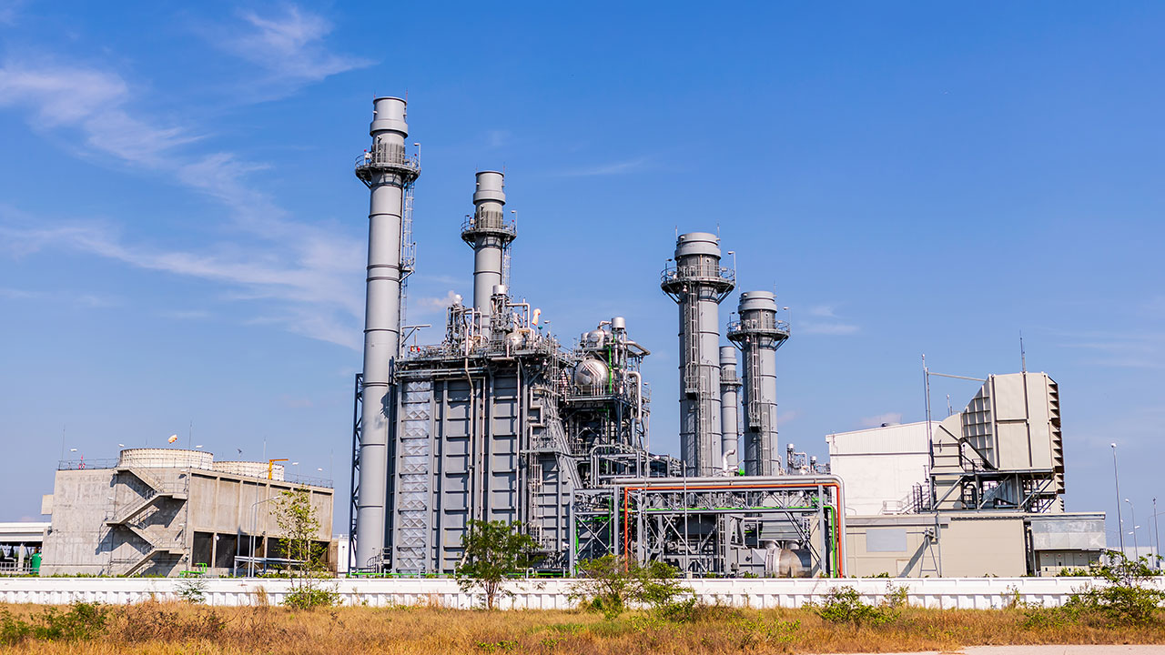 Combined cycle power plant against a blue sky