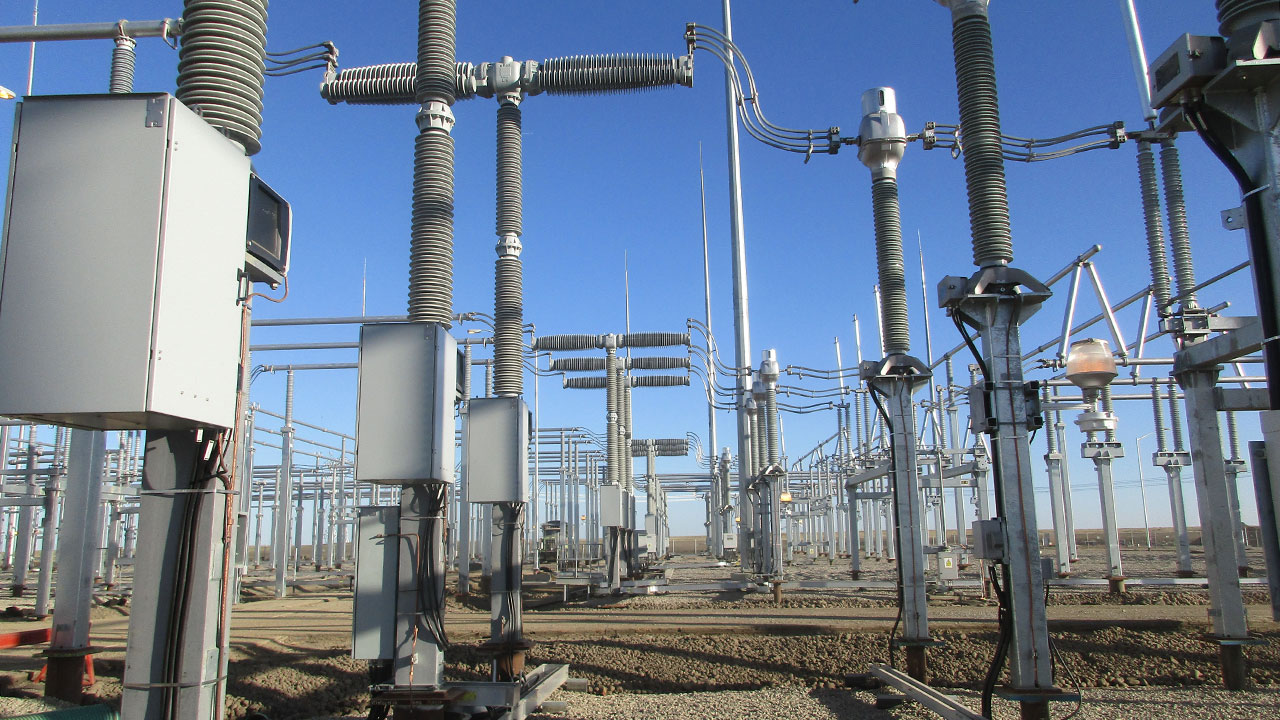 Electrical substation equipment in front of a blue sky