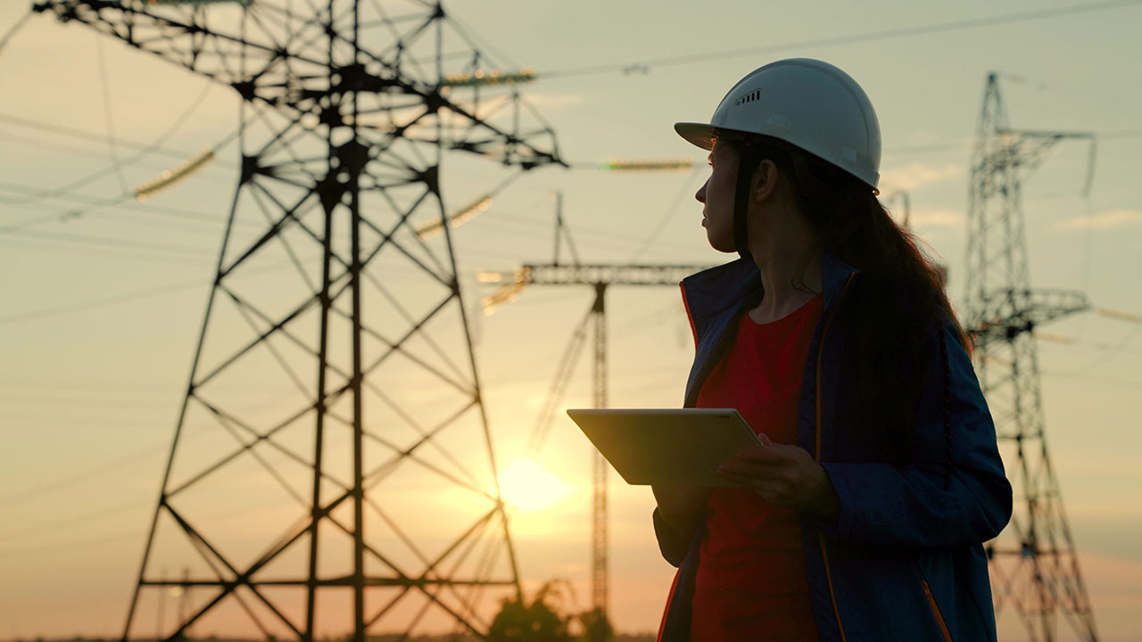 An engineer conducts an assessment at a substation to improve utility operations