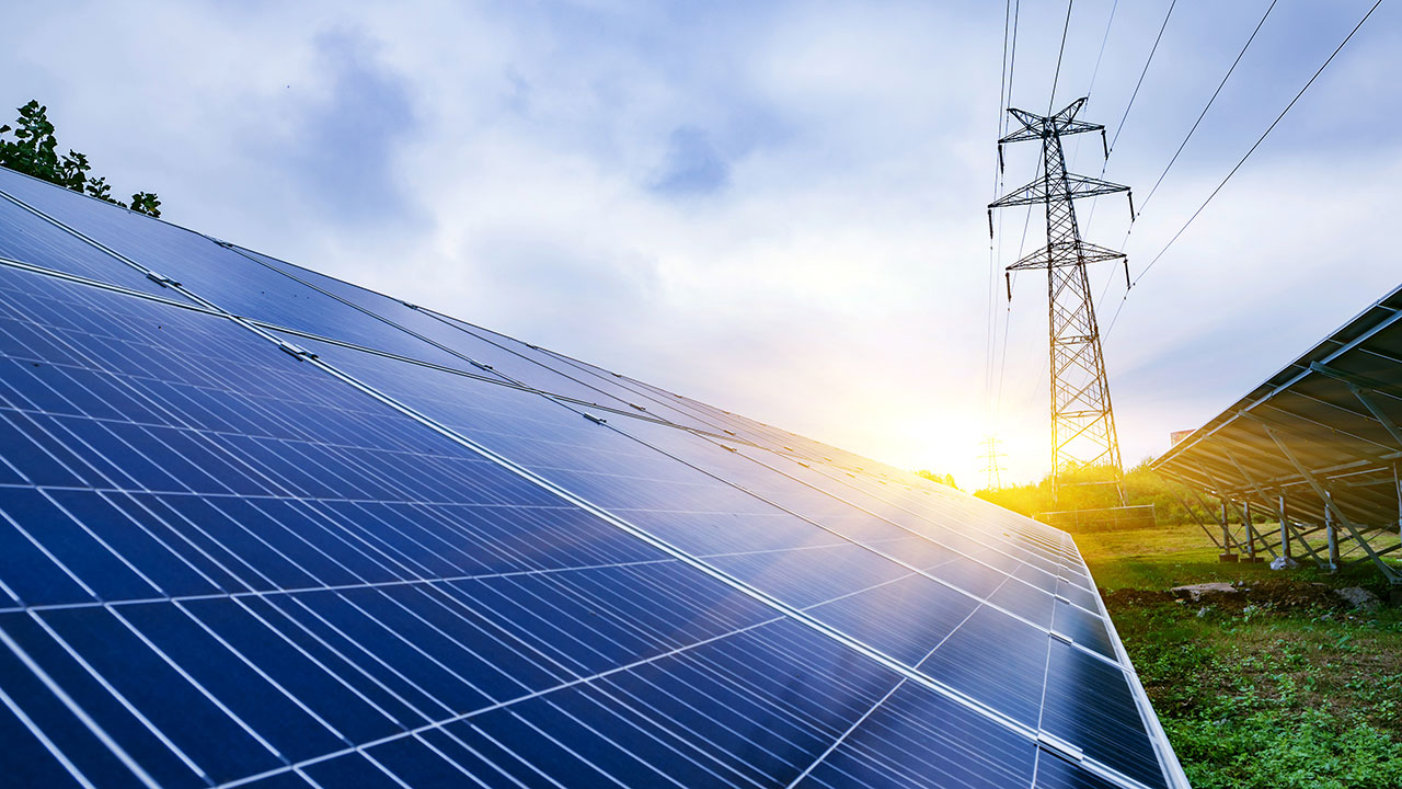 Solar panels at sunrise, providing power to advance the clean energy transition