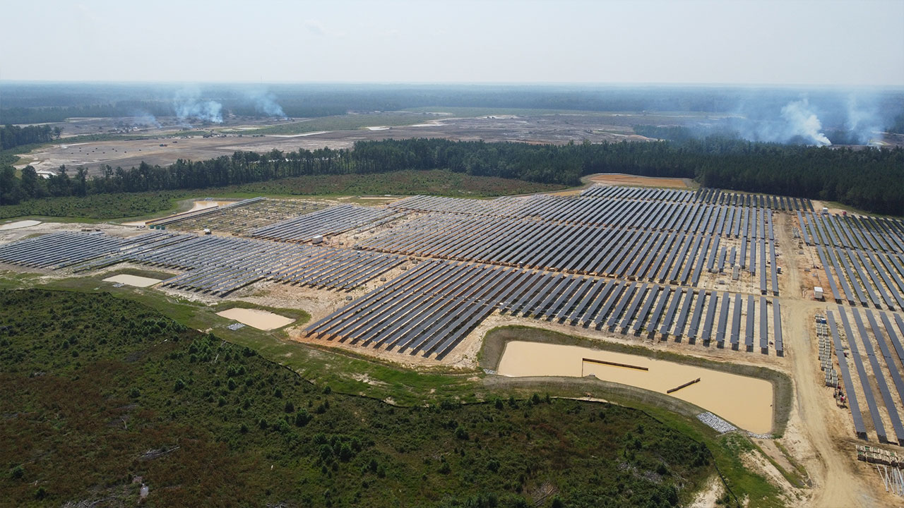 An array of solar panels in a field generating 175-megawatts