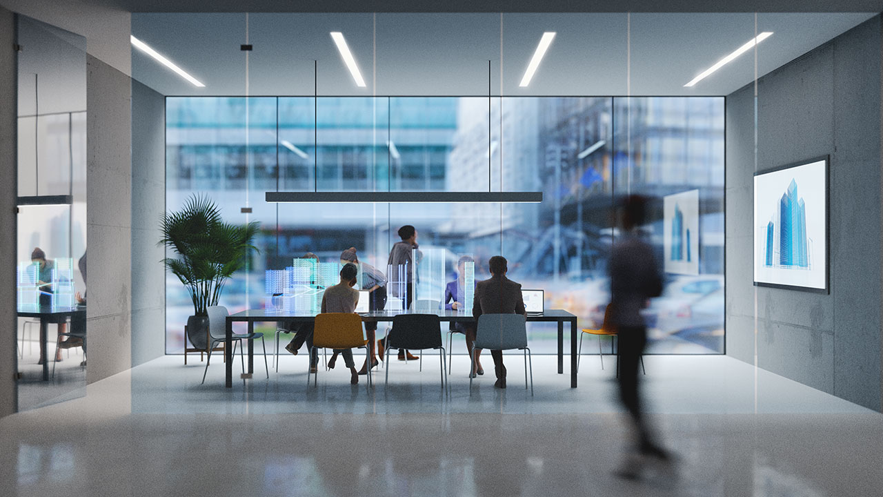 A photo of employees walking, sitting, and working in a Tetra Tech office space with large glass windows