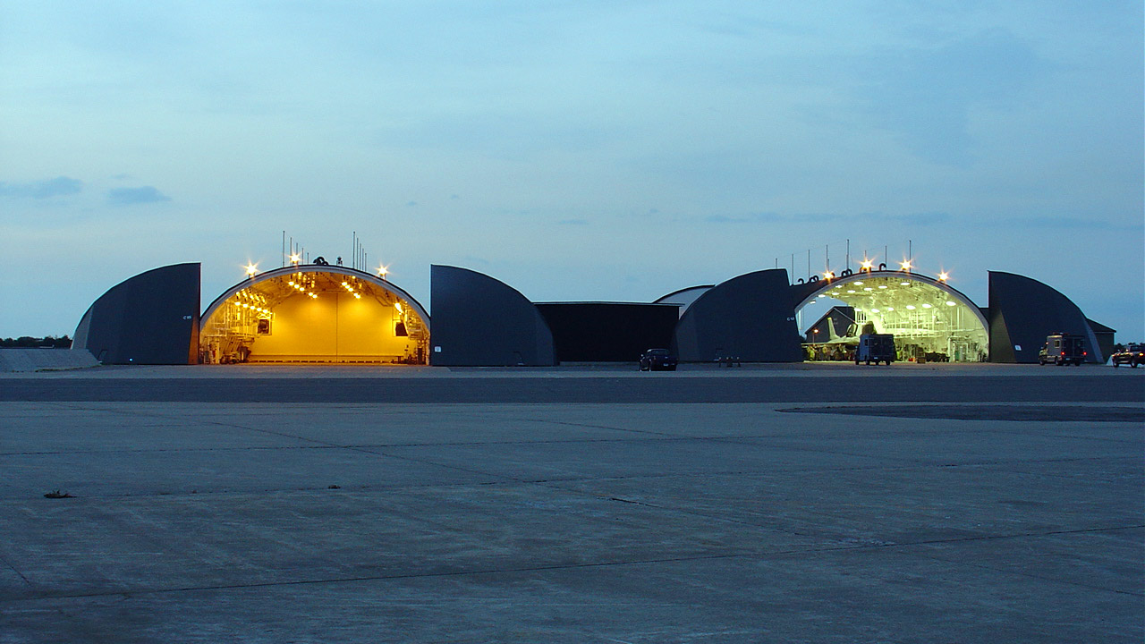 Two aircraft hangars on an airfield base