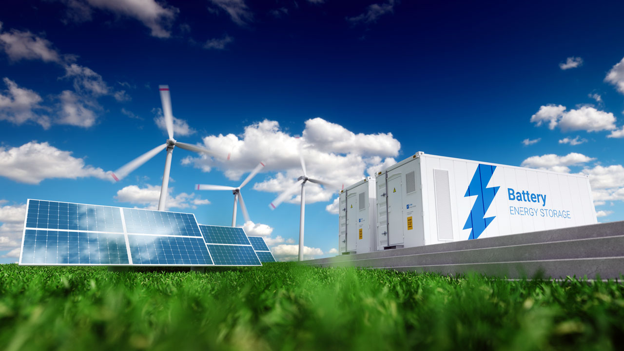 Battery energy storage in a green field under a blue sky with clouds