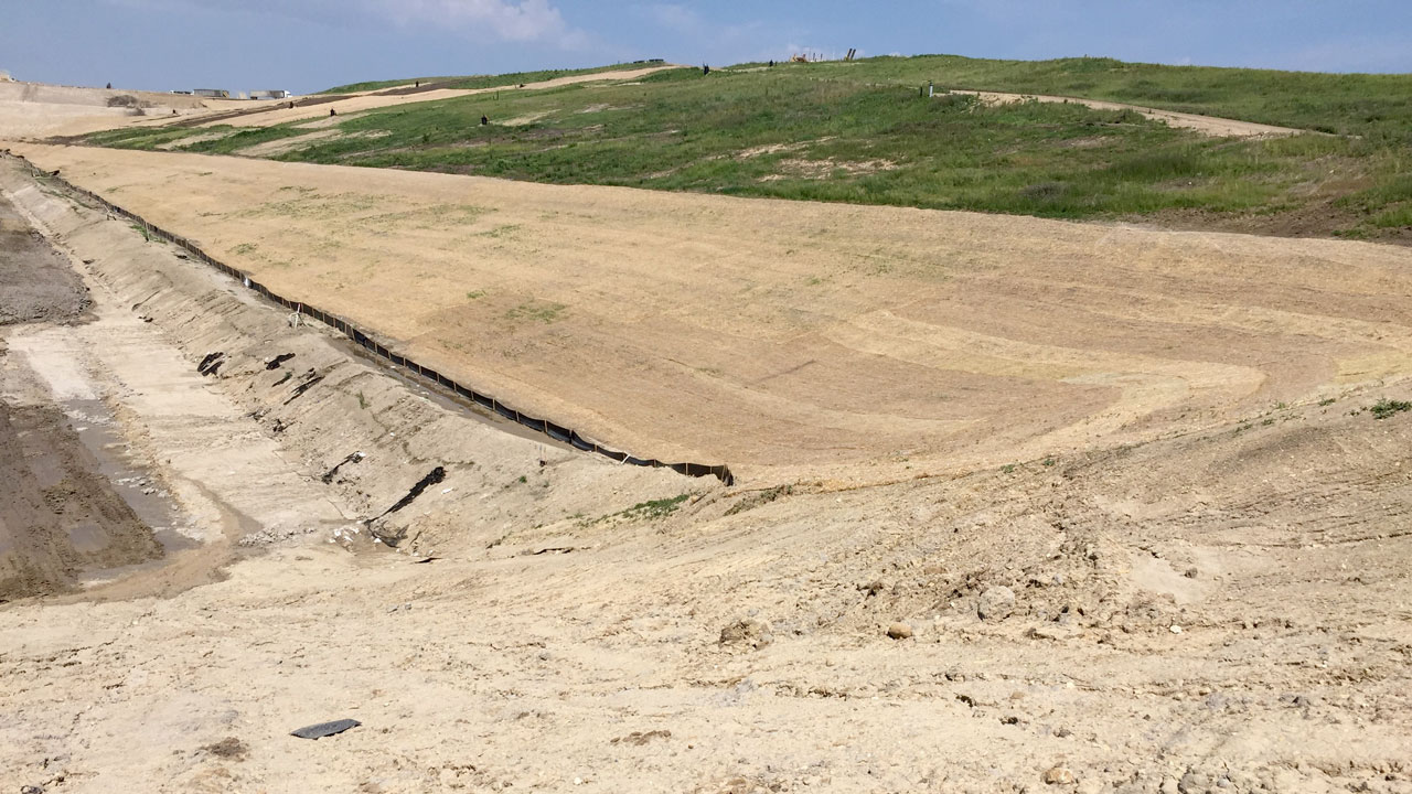 Erosion control measures applied on a landfill side slope