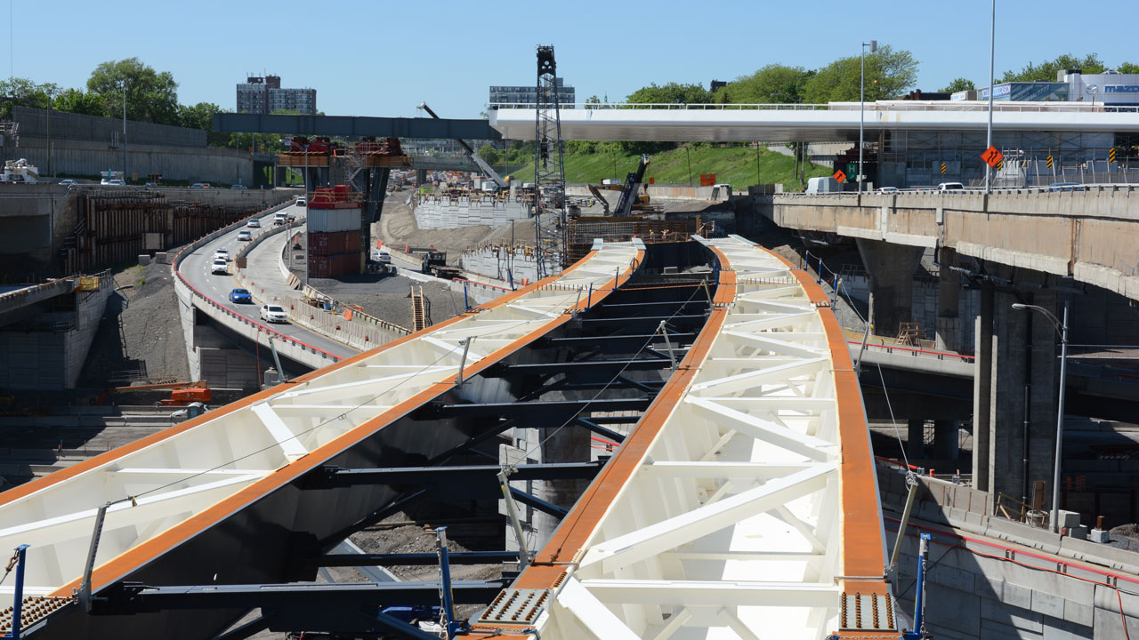 Bridge and complex interchange construction by different contractors, maintaining traffic on old structures