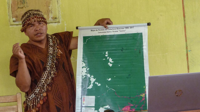 A member of the Yamino Native Community forest governance body in Ucayali, Peru, presents during a community meeting
