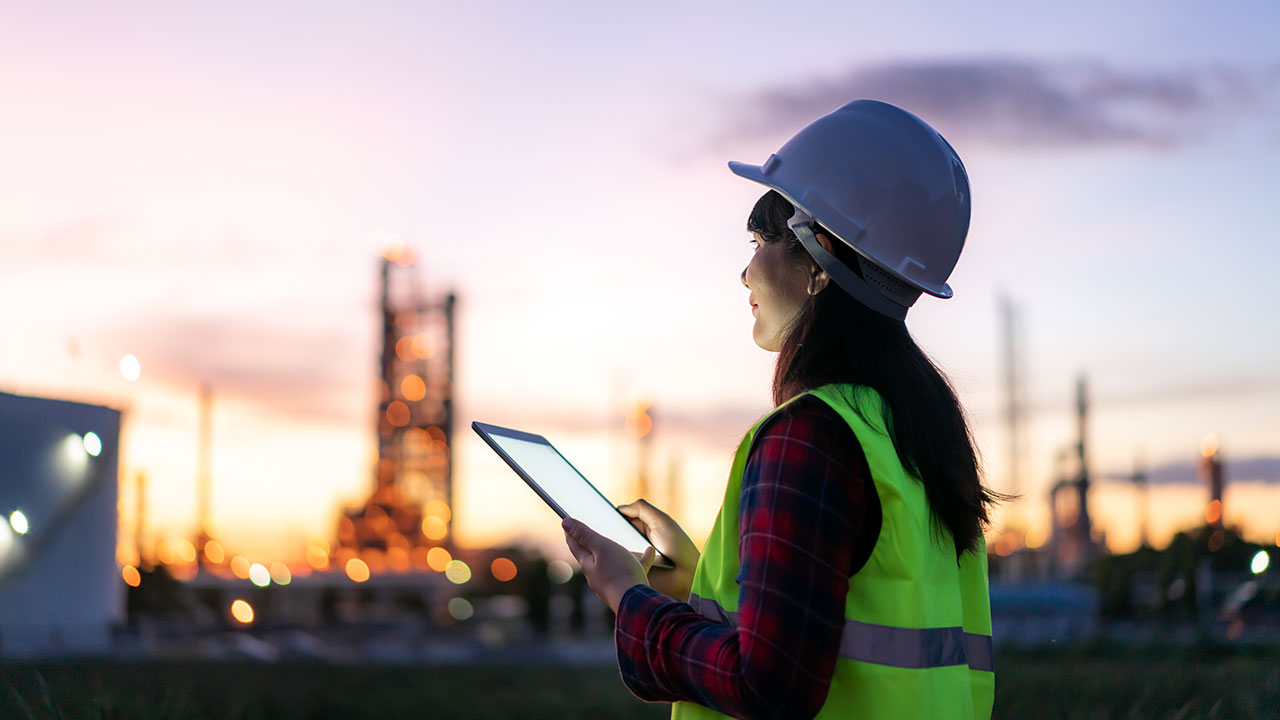 Woman performing audit at an industrial facility