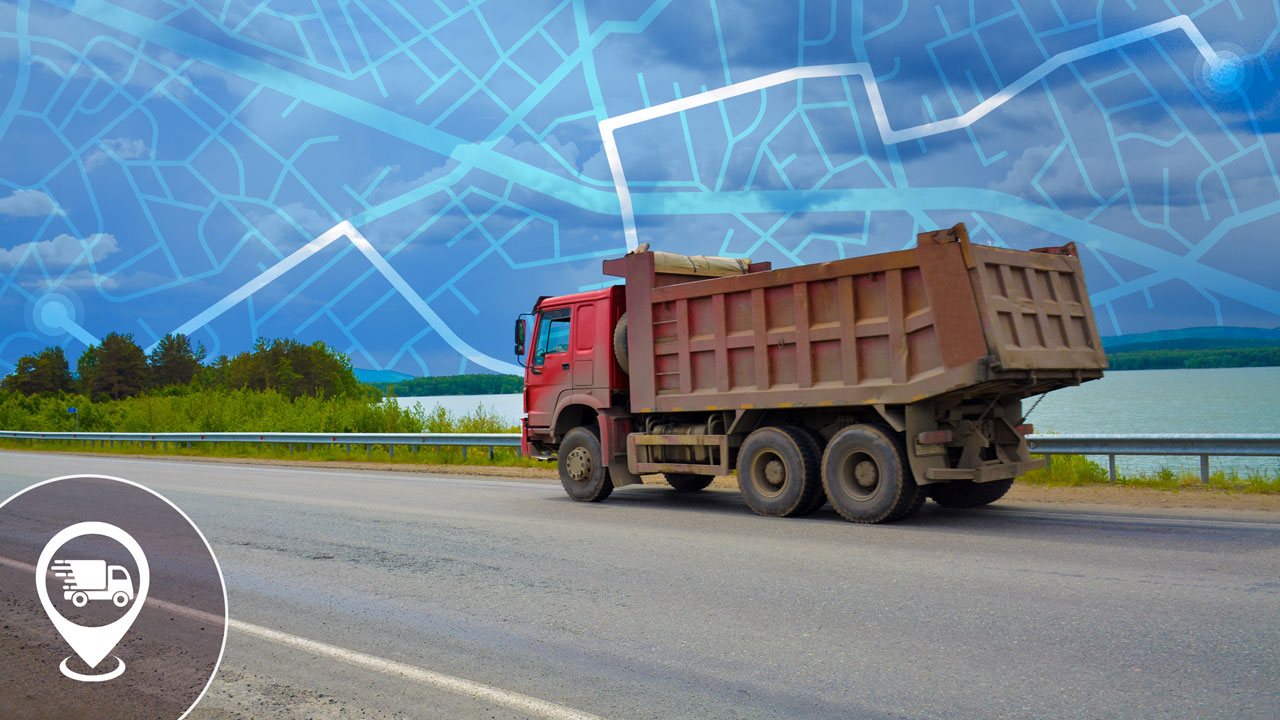 Dump truck traveling down roadway with superimposed mapping graphic in background