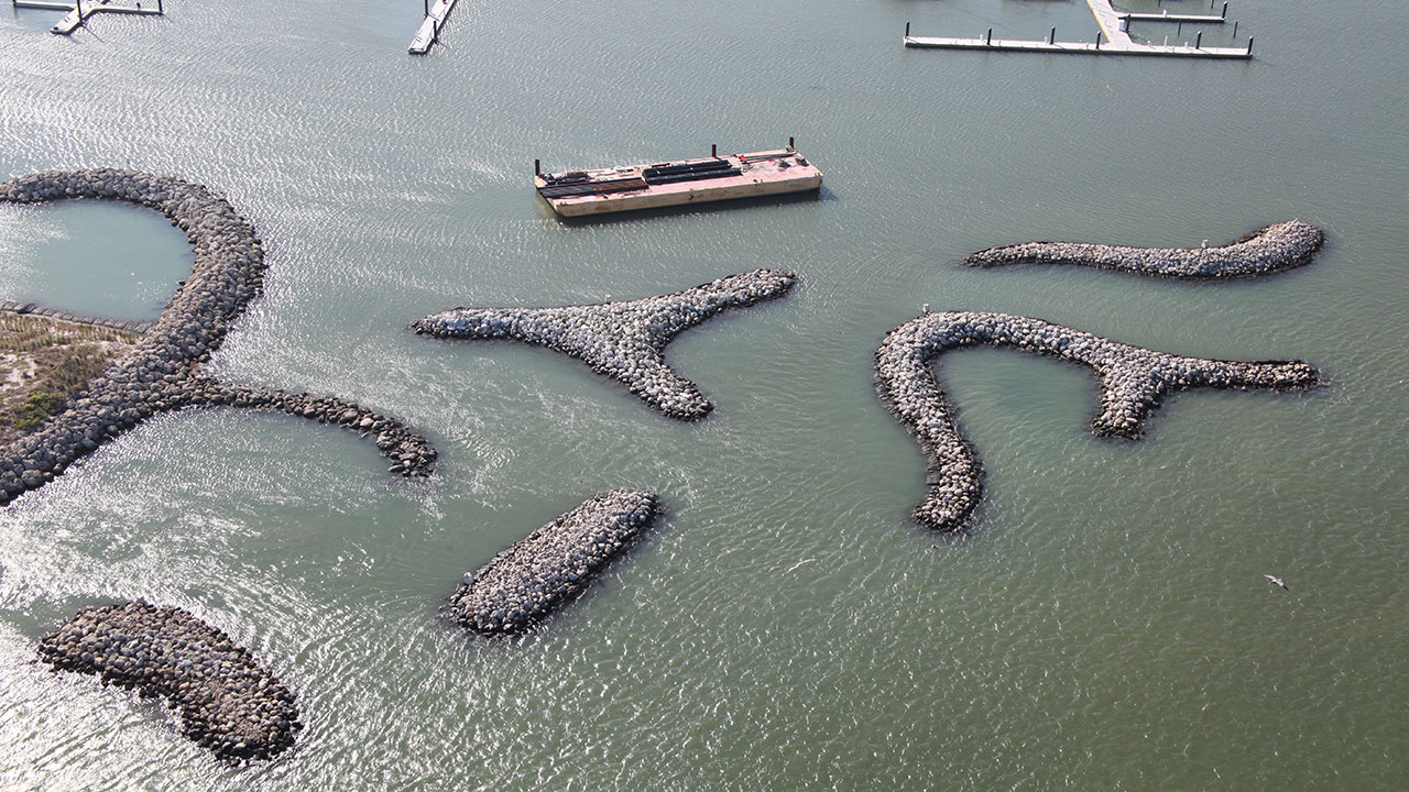 The complex breakwater island configurations protect the Fort Pierce marina from waves while minimizing disruption