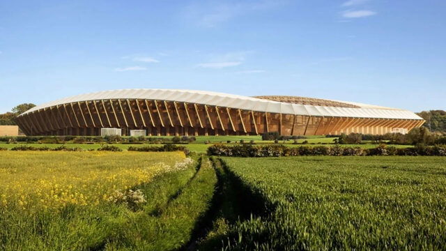 A sweeping view of a green field in front of the new Forest Green Rover’s Stadium