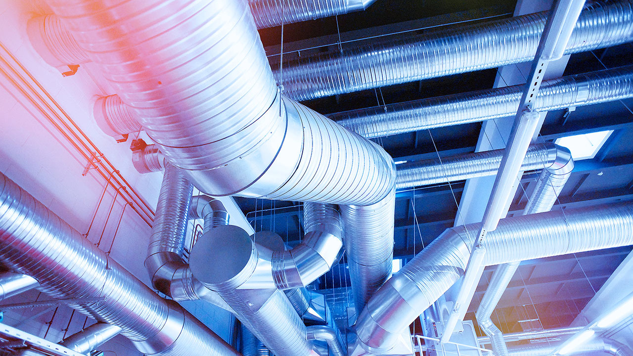 Low angle view of ventilation pipes in a factory