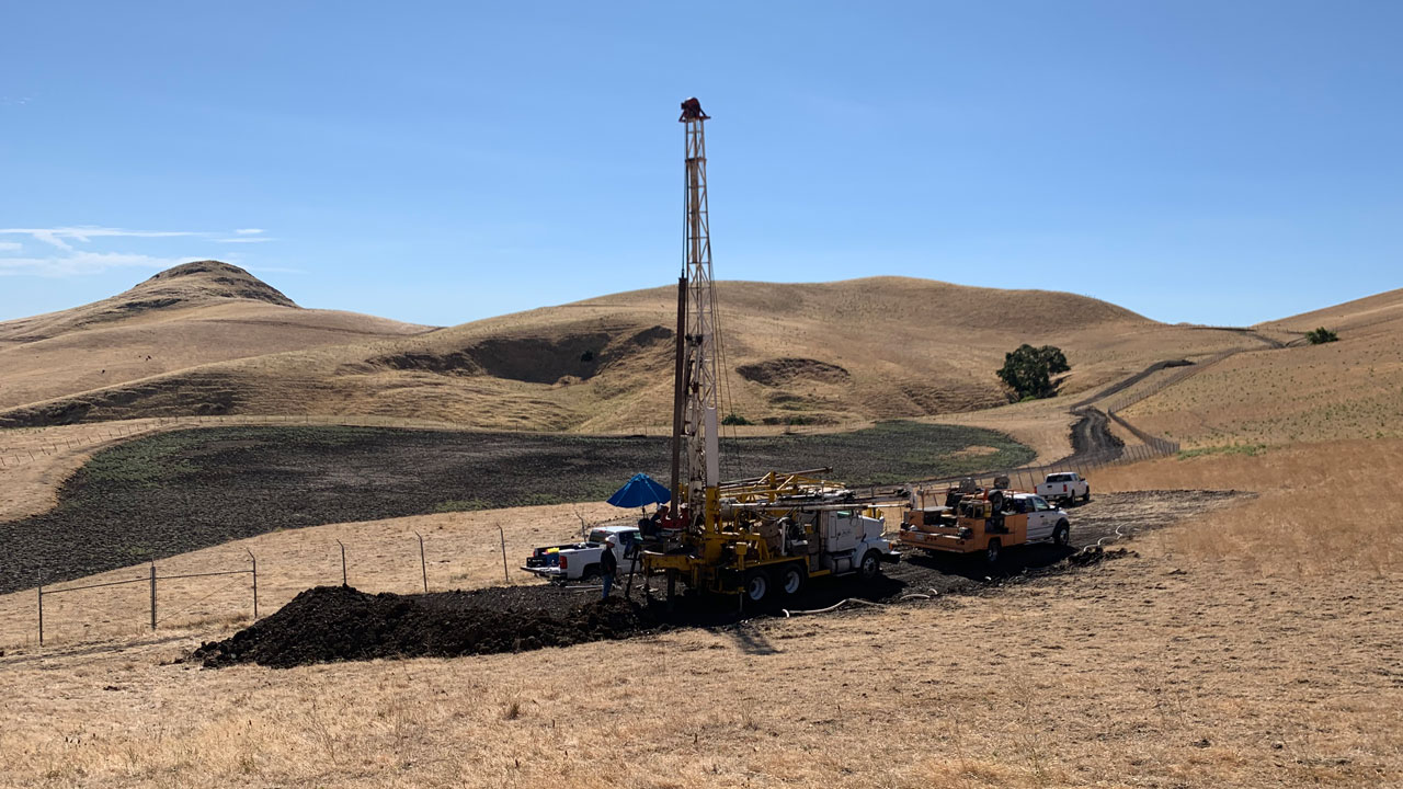 Drill rig during collection of soil borings to characterize subsurface geology at proposed disposal cell