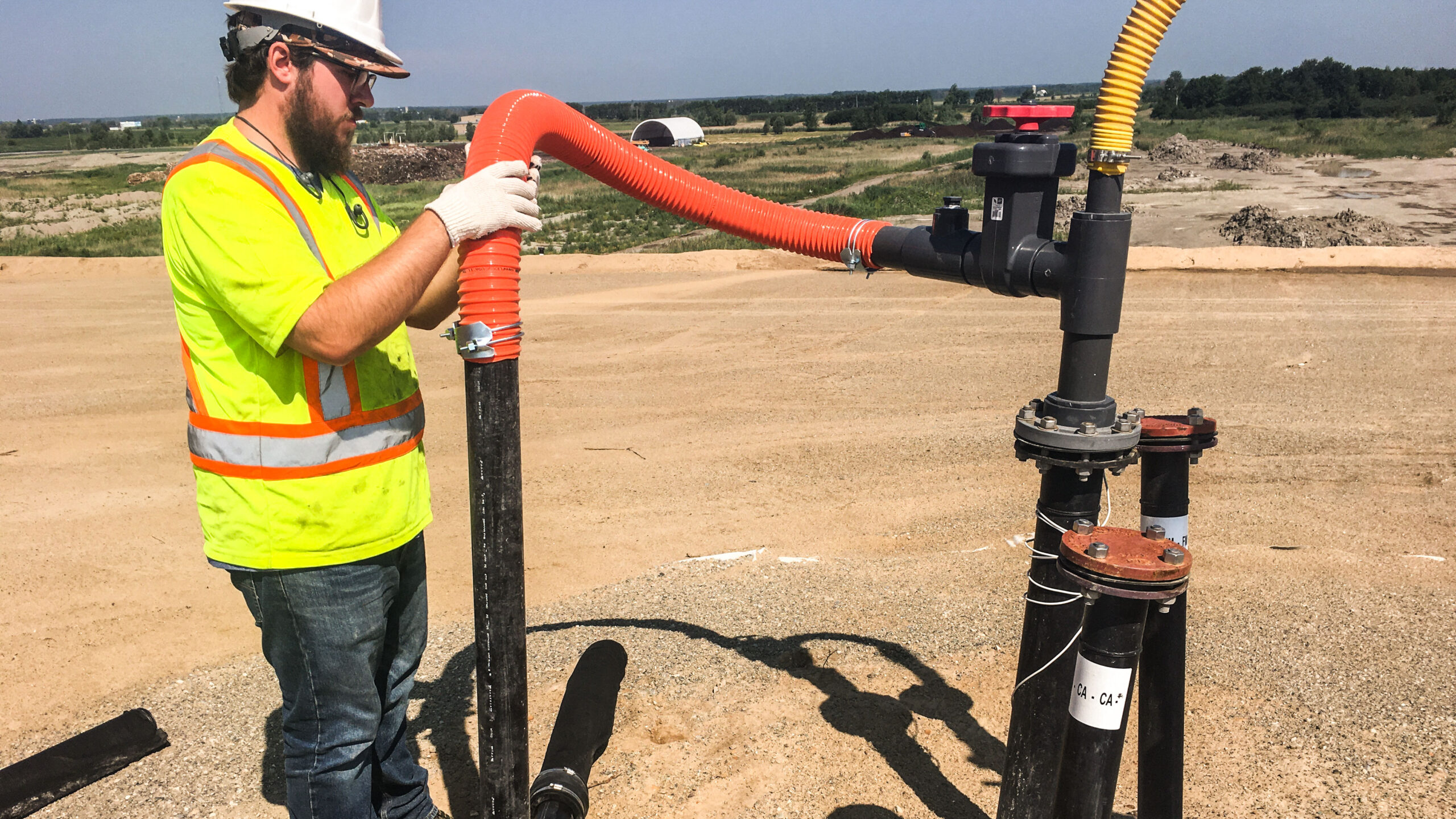 Tetra Tech worker installing a landfill gas wellhead