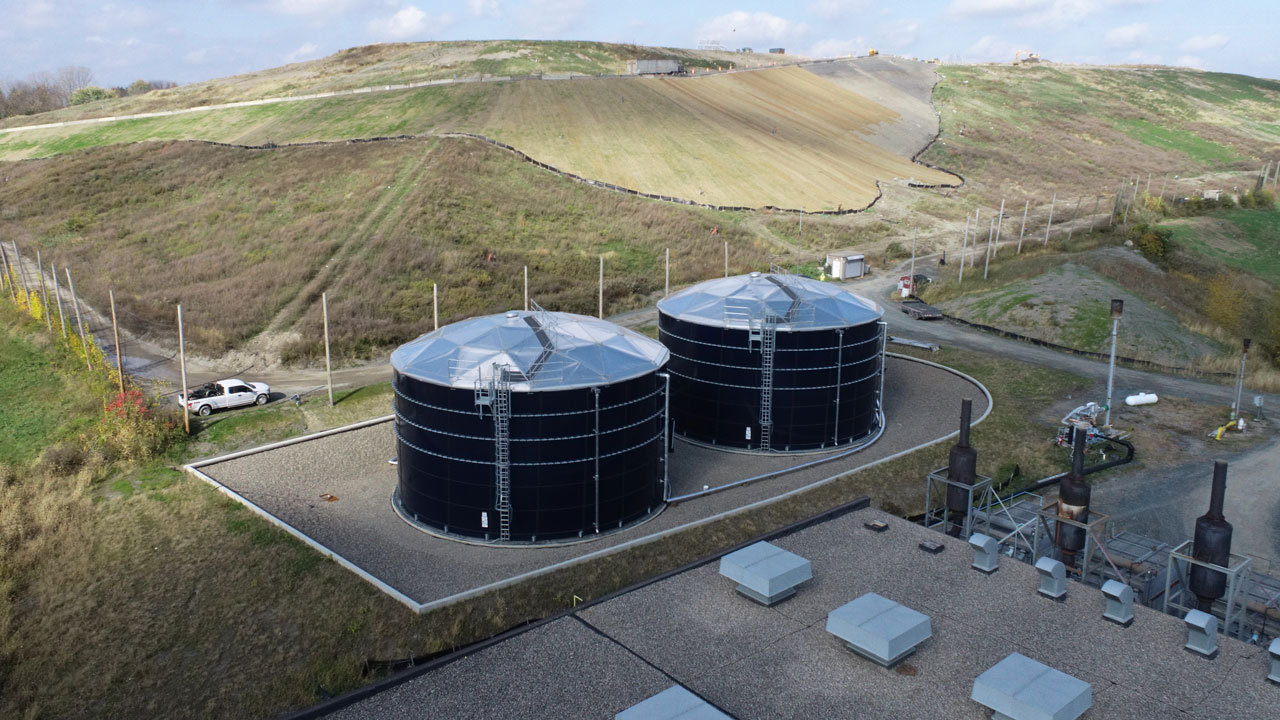Aerial view of two leachate storage tanks with secondary containment