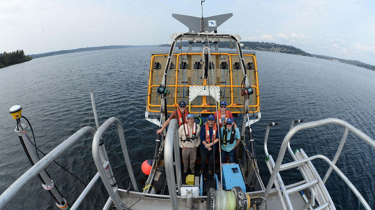 Five Tetra Tech bathymetric survey crew members pose with Ultra TEMA-4 for detection of underwater munitions and unexploded ordnance