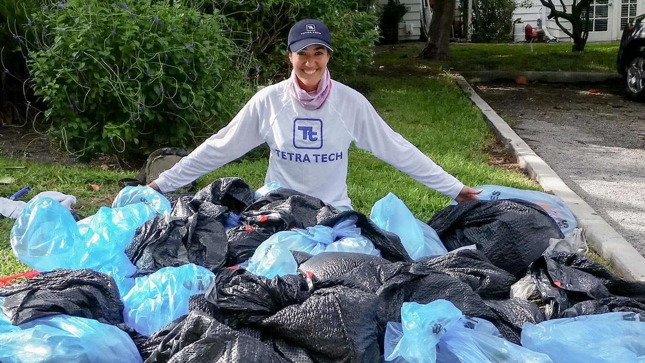 Tetra Tech employee training local residents on collection of waste in coastal areas