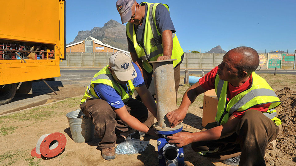 Municipal water department employees installing a new valve in Cape Town, South Africa