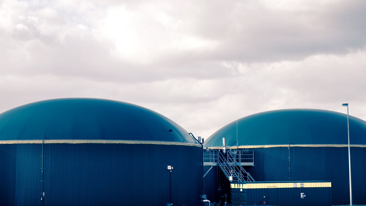 Anaerobic digester with a sky in the background