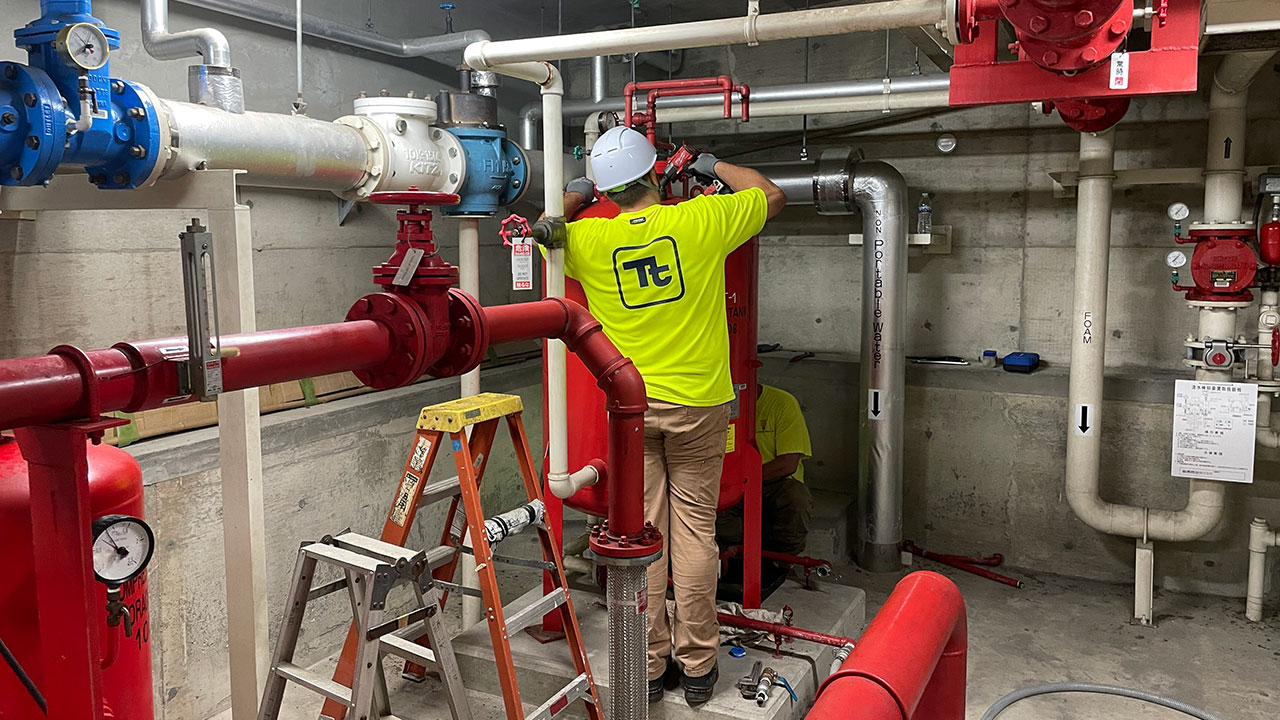 Tetra Tech employees conducting aqueous film forming foam (AFFF) replacement