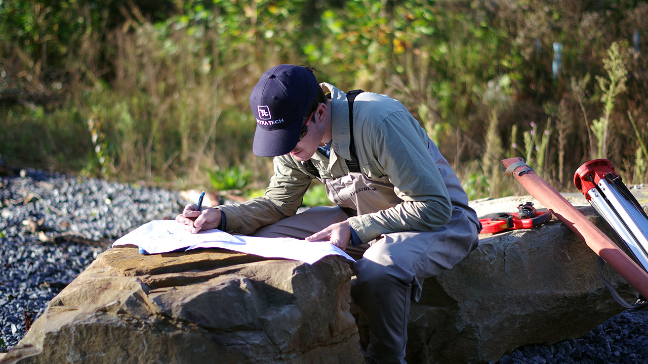 A Tetra Tech employee reviews field maps prior to monitoring stream conditions in Georgia