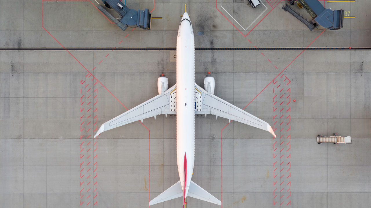 An overhead view of an airplane on a tarmac