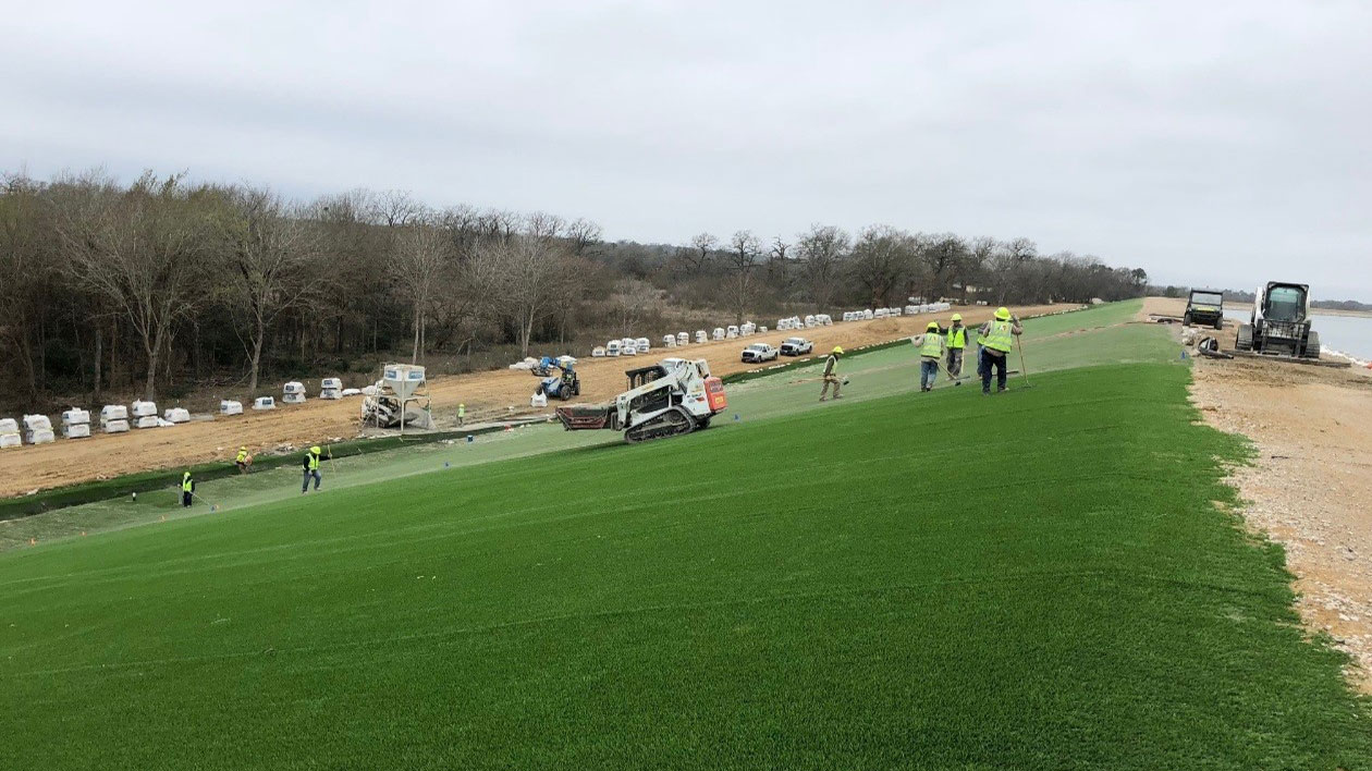 Tetra Tech installing HydroTurf® around the power plant reservoir to protect against berm erosion due to flooding