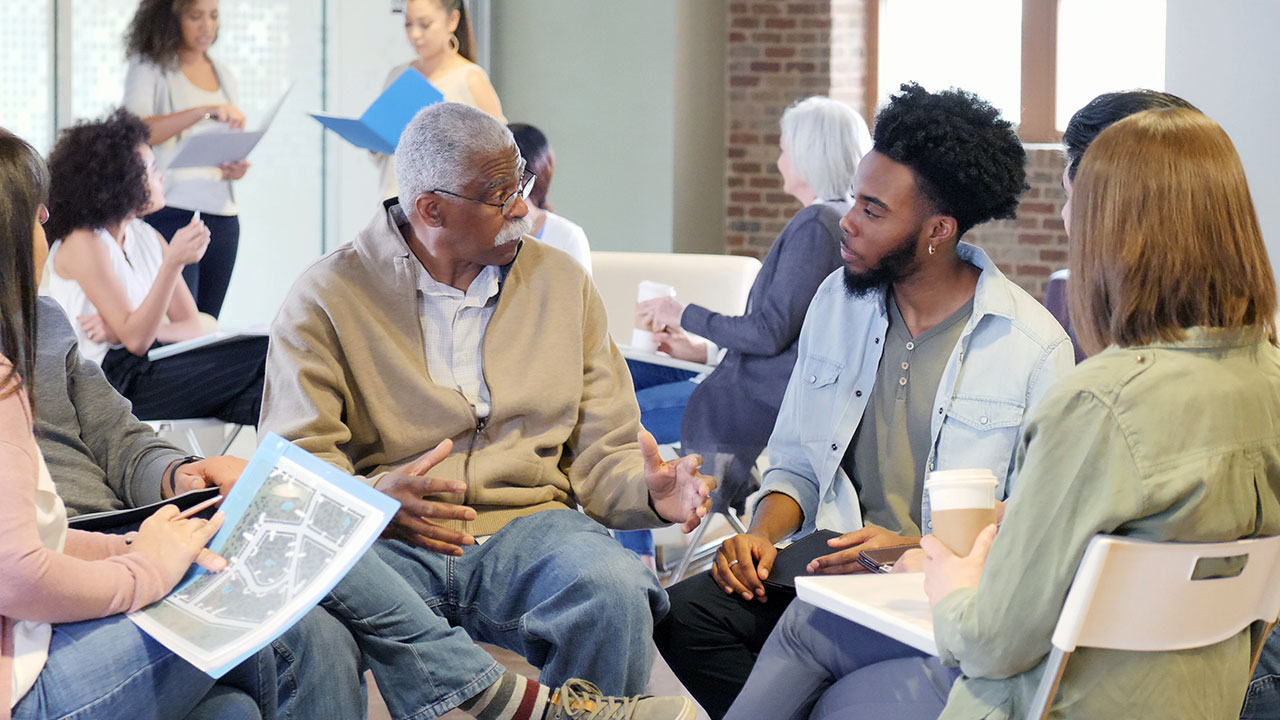 Community members and stakeholders review and discuss hazard mitigation plans in public workshop