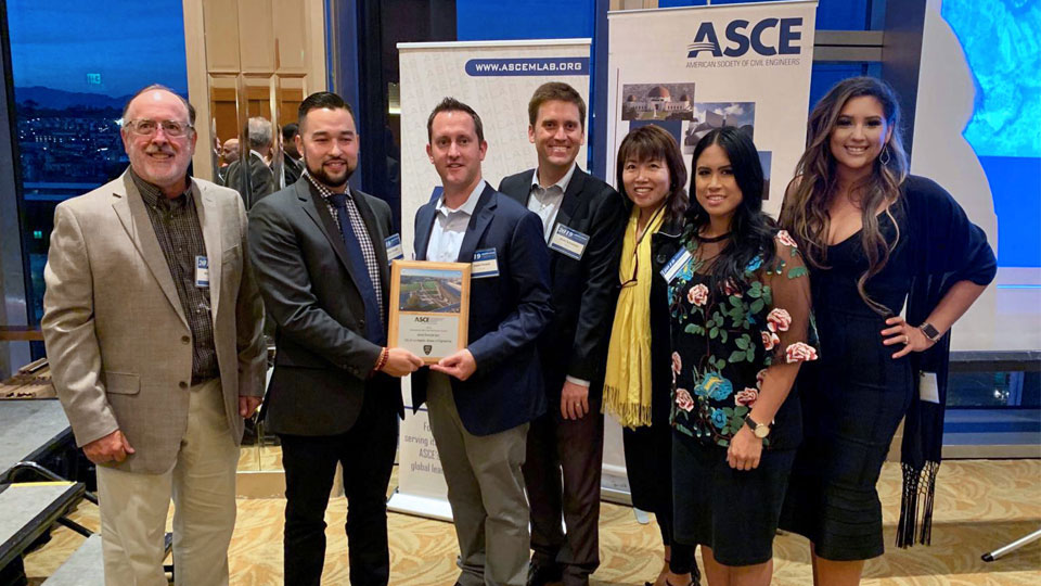 The project team takes a photo after receiving the ASCE’s 2019 Outstanding Parks and Recreation Project of the Year