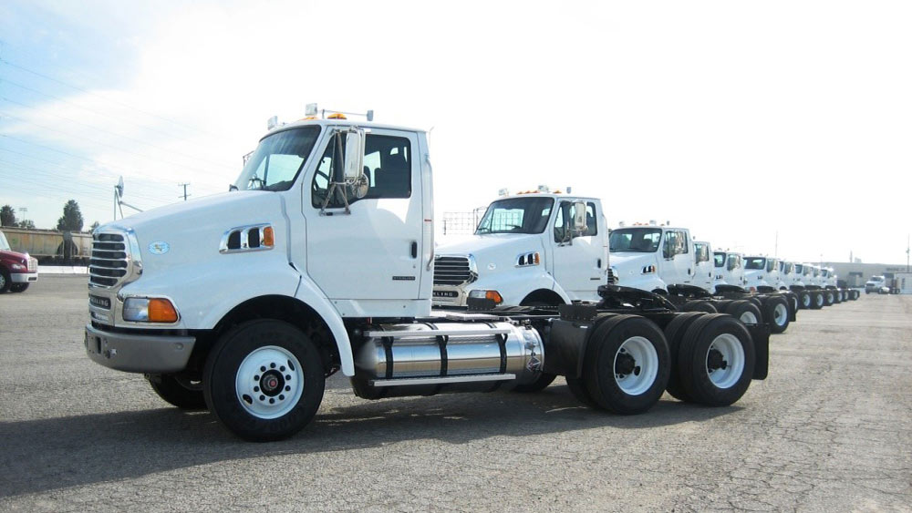 Low emission, heavy-duty trucks lined up as part of the Tetra Tech-supported Clean Truck Program