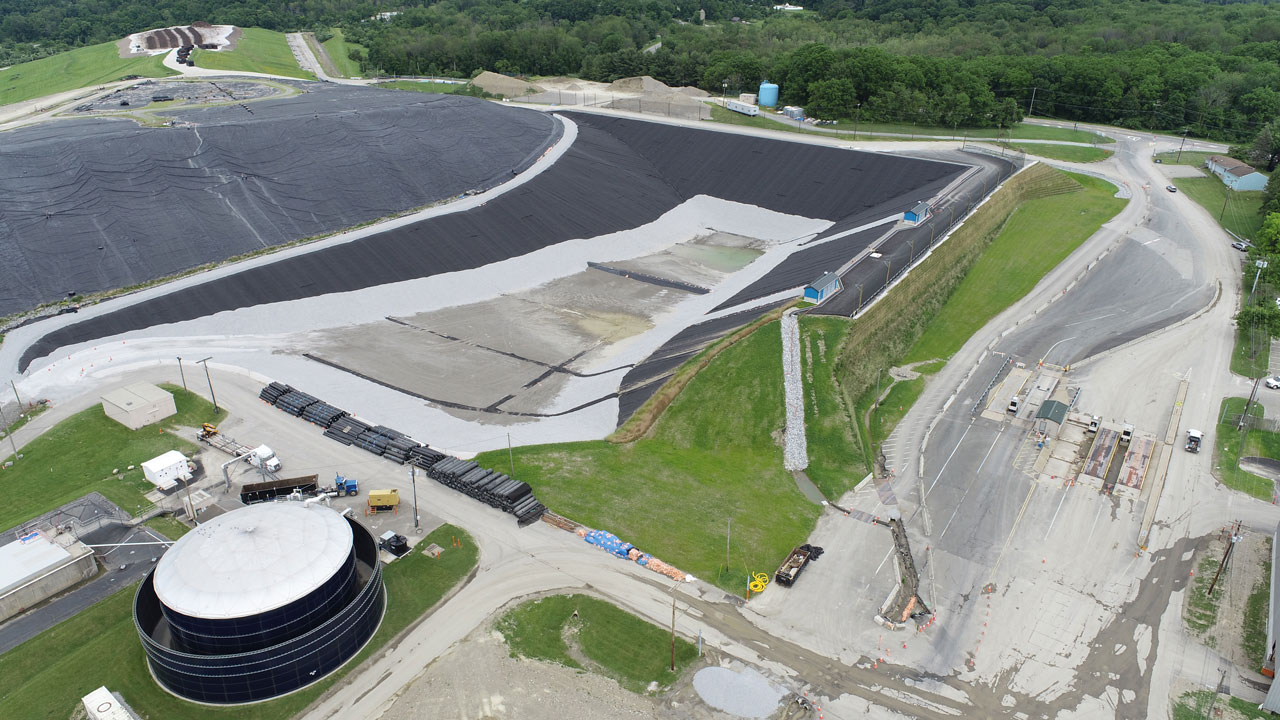 Landfill facility showing closure, stormwater structures and leachate holding tank