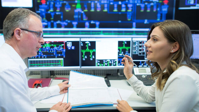 Employees at Kosovo’s transmission system operator discuss processes for managing electricity flows