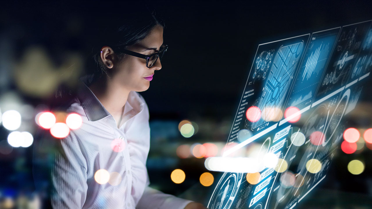 Woman staring at futuristic graphical user interface floating screens