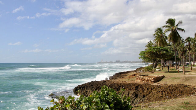 A shoreline in the Dominican Republic, where solid waste management challenges impact coastal ecosystems