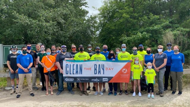 Team members clean up trash in local parks in support of the Chesapeake Bay Foundation