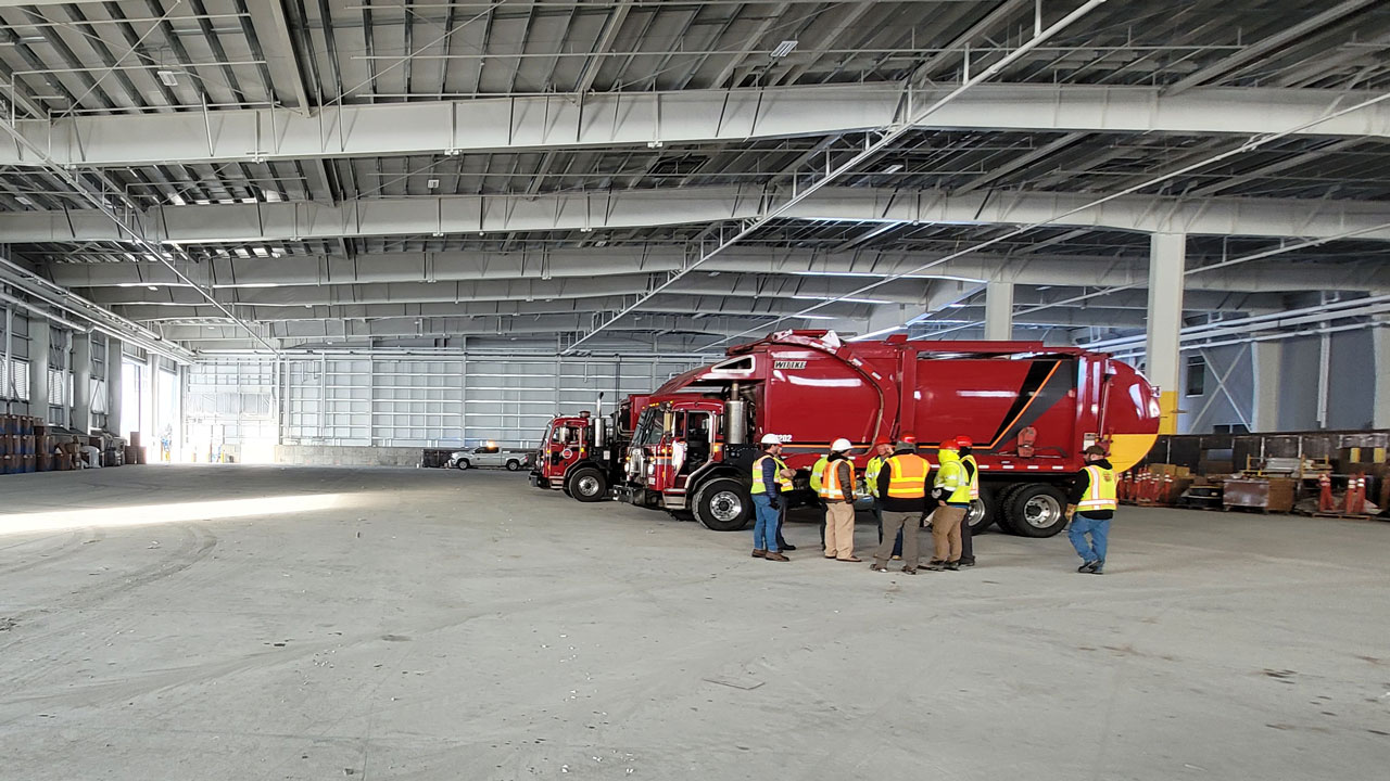 Construction inspectors certifying a transfer facility has been completed in compliance with construction plans