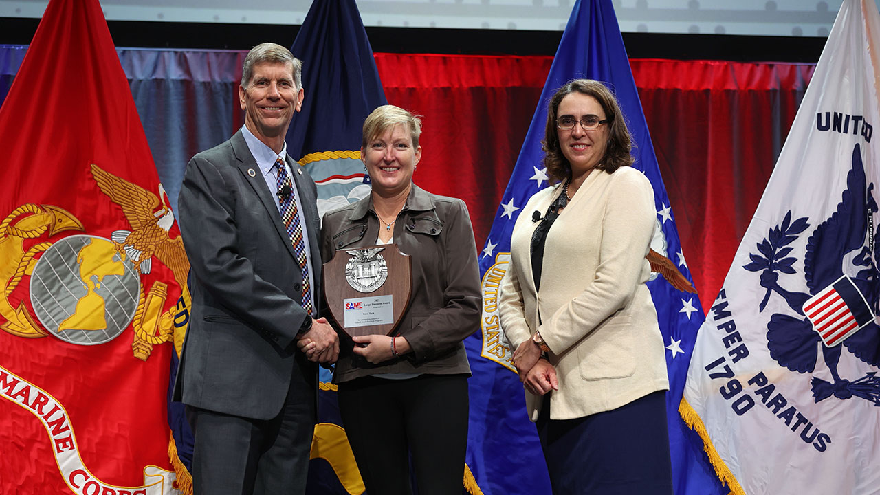 Tetra Tech employee receiving the SAME Large Business Award from two people