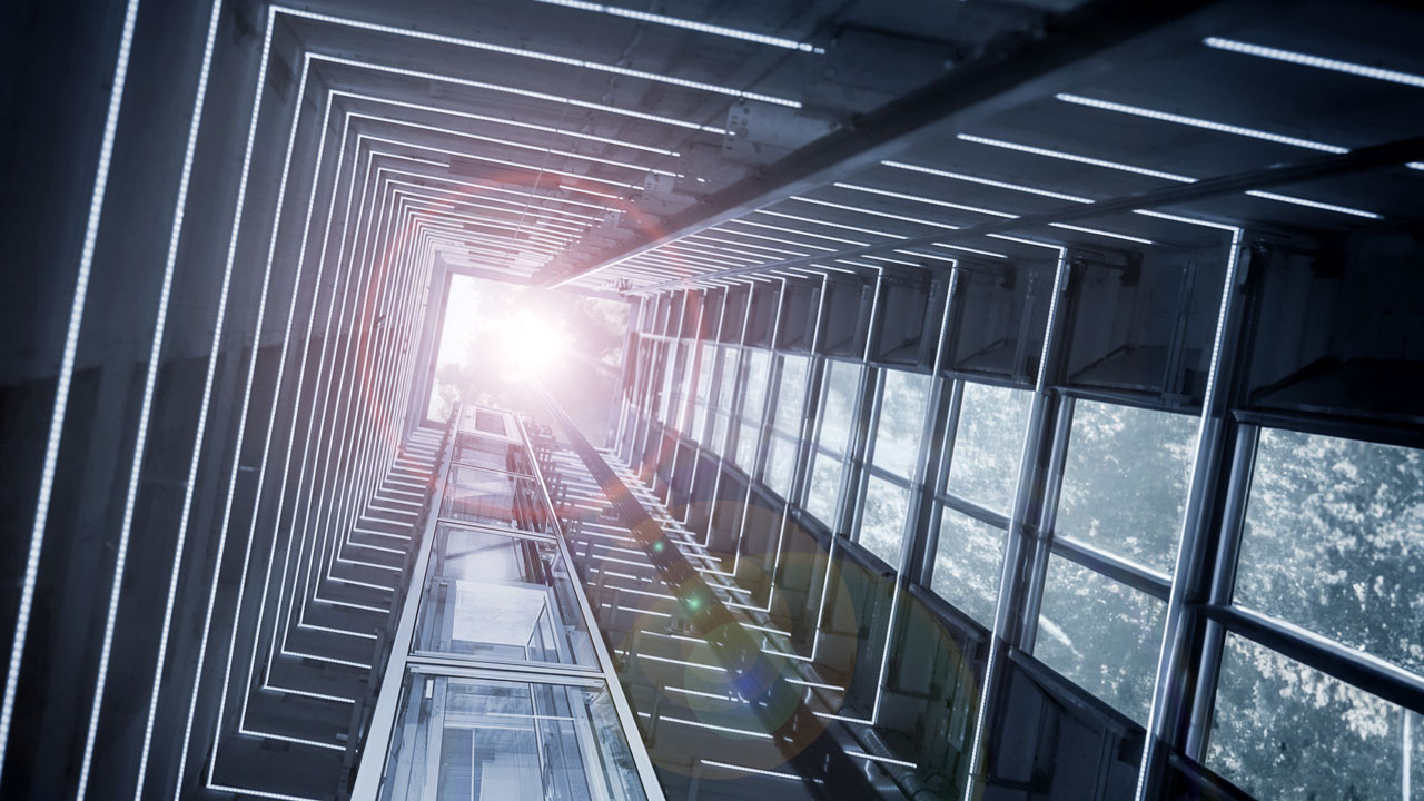 The ground-view of an empty elevator shaft repurposed into a lightwell