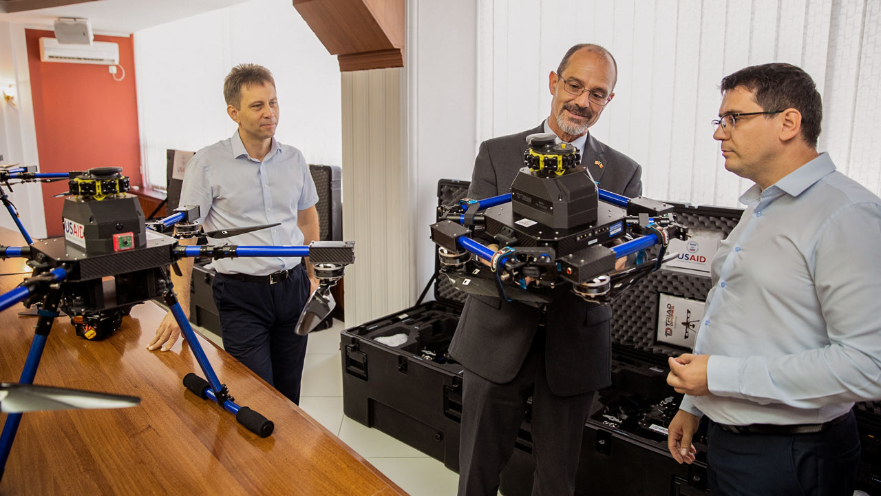 USAID Moldova Mission Director Jeff Bryan inspects drone equipment provided to Moldova’s electricity transmission system operator, Moldelectrica