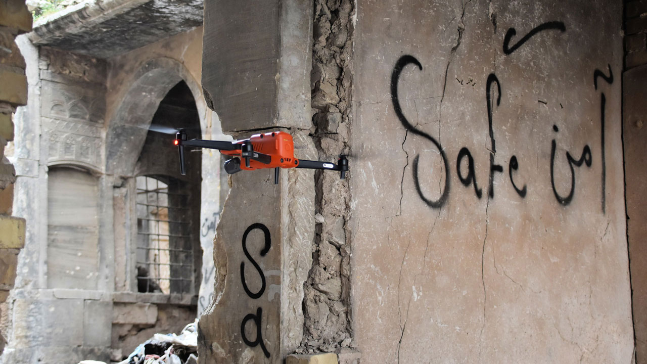 A drone piloted by Tetra Tech scanning a damaged building for improvised explosive devices (IEDs)