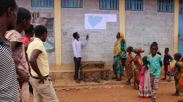 A man shares results of the mapping and demarcation process in East Bale Zone with a small group