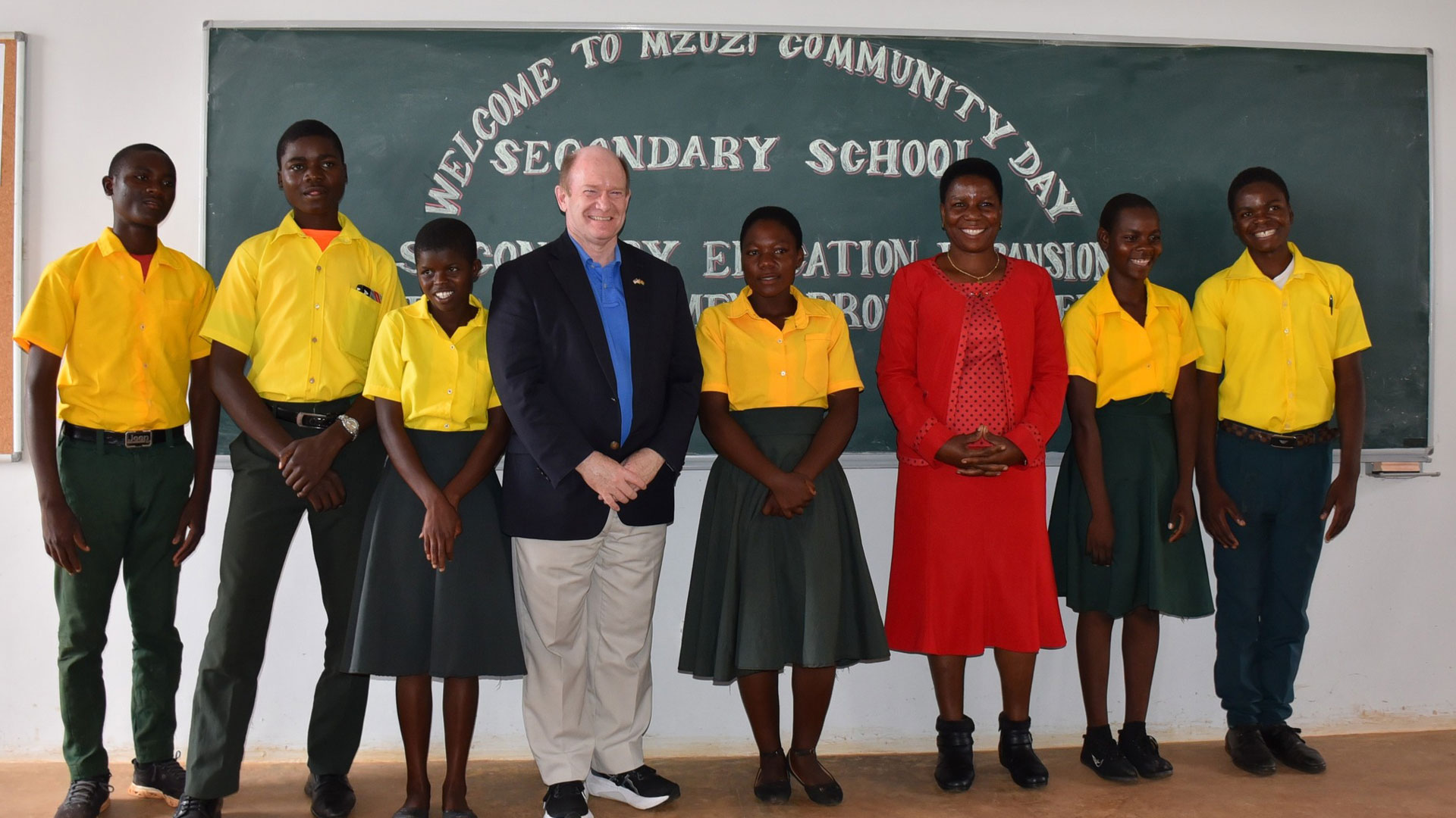U.S. Senator Chris Coons of Delaware with students and teachers at the Mzuzi Community Day Secondary School